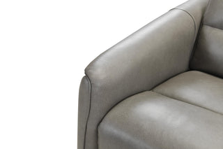 Close-up of a gray sofa corner on a white background