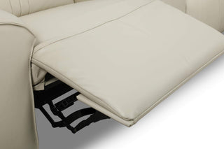 close-up of a reclined seat of a beige electric recliner sofa