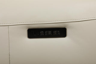 Close-up of a beige leather sofa with buttons and usb ports