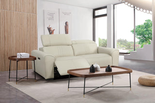 Beige electric recliner leather sofa in a modern living room with a coffee table and side table.