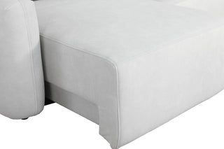 Close-up of a white sofa corner on a white background