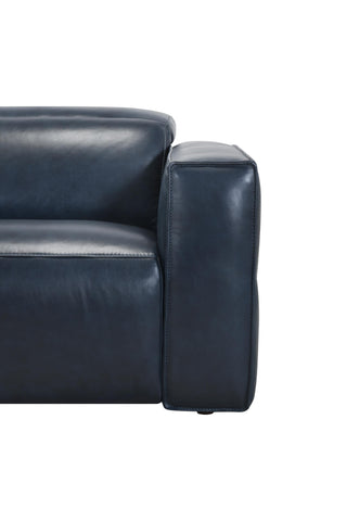 Close-up of a dark blue leather sofa on a white background