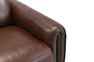Close-up of a brown leather sofa on a white background
