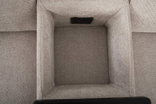 Close-up of a textured gray fabric sofa with opened middle console