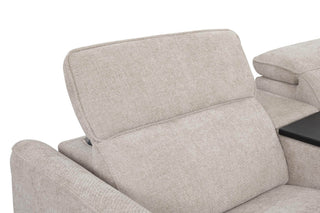 Beige recliner sofa with armrests on a white background