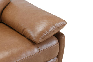 Close-up of a brown leather sofa with a white background