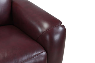Close-up of a brown leather sofa on a white background