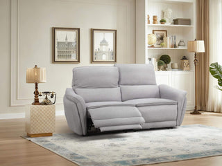 Gray fabric recliner sofa in a living room setting with decor elements.