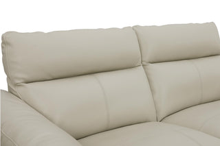 Beige leather sofa on a white background