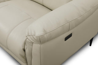 Beige leather sofa focused on the stitching and padding