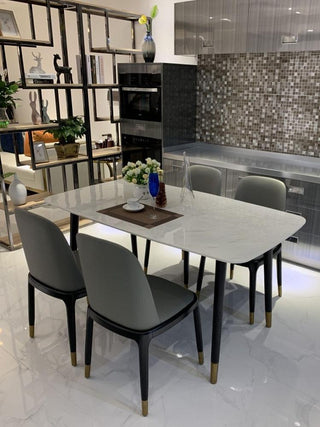 rounded rectangle marble dining table in black gold tip legs