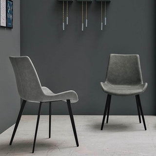 two grey scoop dining chairs with metal feet