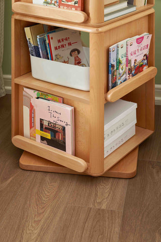 Wooden bookshelf with books on a wooden floor