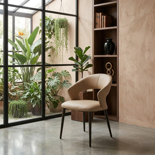 Beige chair in a modern interior with plants and bookshelf