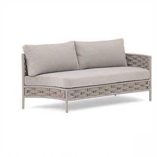 Beige outdoor sofa with woven frame and cushions on a white background