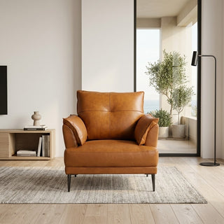 Brown leather armchair in a modern living room with a rug and decorative items.