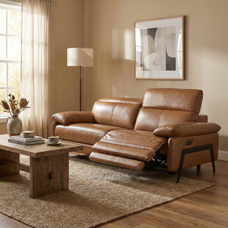 Brown leather sofa in a living room with a wooden coffee table and abstract art on the wall.