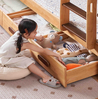 Child playing with wooden toys on a bed