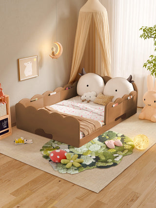 Children's room with a bed, toys, and decorative elements.