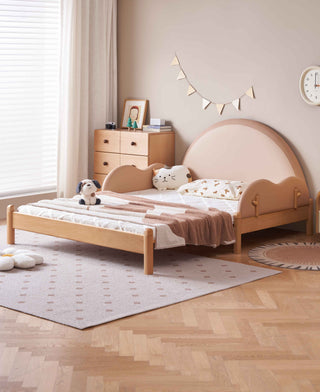 Children's bedroom with a wooden bed and decorative items.
