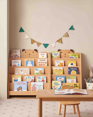Children's bookshelf with books and a small table in a room setting.