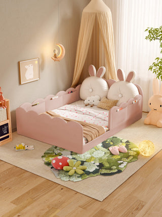Children's room with a pink bed featuring bunny ears and a decorative rug with plants.