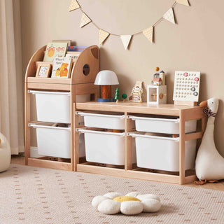 Children's storage unit with white bins and wooden shelves in a room setting.