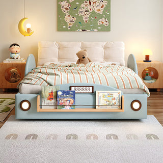 Children's bed with bookshelf design, teddy bear, and decorative items in a room setting.