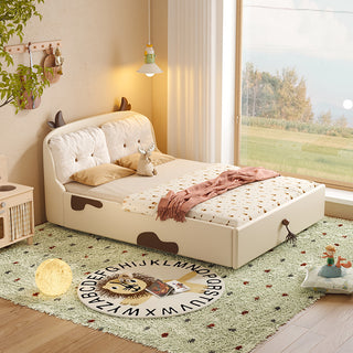 Children's bedroom with a bed, rug, and toys near a window.
