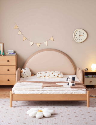 Childrens bedroom with a wooden bed, toys, and decorative elements.