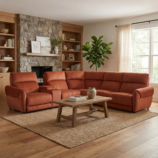 Cozy living room with a brown sectional sofa, wooden coffee table, and stone fireplace.