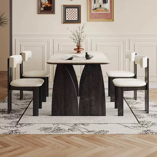 Dining room set with a marble table and chairs in a stylish interior.