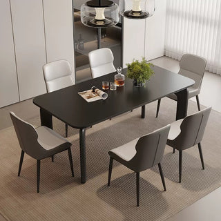 Dining table set with six chairs in a modern interior setting.