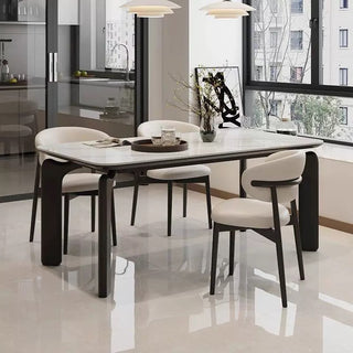 Dining table with chairs in a modern kitchen setting