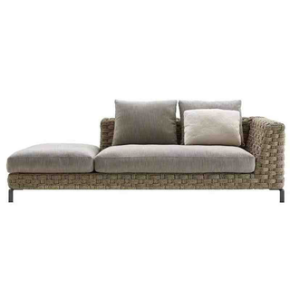 Gray sofa with woven armrests and cushions on a white background
