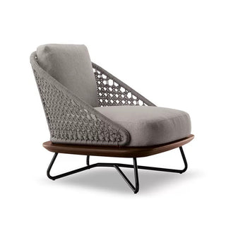 Modern lounge chair with gray cushion and wooden armrest on a white background