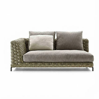 Gray sofa with wicker frame and cushions on a white background
