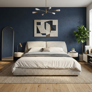Modern bedroom with a queen size bed frame, nightstands, and decorative elements against a dark blue wall.