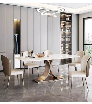 Modern dining room with a stylish table and chairs in a well-lit room.