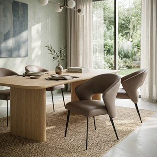 Modern dining room with wooden table and brown restaurant chairs near large windows.