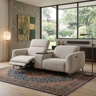 Modern fabric recliner chair in a living room with large windows and decorative rug.