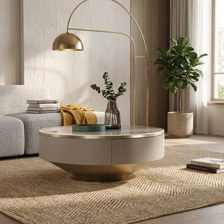 Modern living room with a circular coffee table, floor lamp, and decor items.