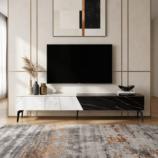 Modern living room with a television mounted on the wall, decorative vases, and a patterned rug.