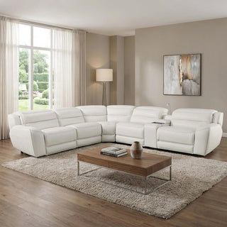 Modern living room with a white sectional sofa, wooden coffee table, and abstract art on the wall.