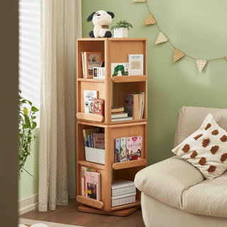 Montessori Rotating Bookshelf with books and decorative items against a green wall with a beige sofa.