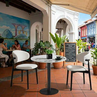Outdoor with restaurant tables, chairs, and a mural of Singapore landmarks.