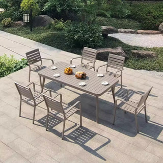 Outdoor dining set with table and chairs on a patio