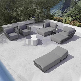 Outdoor patio furniture set on a patio with a scenic background