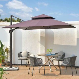 Outdoor patio set with a large parasol providing shade on a wooden deck.