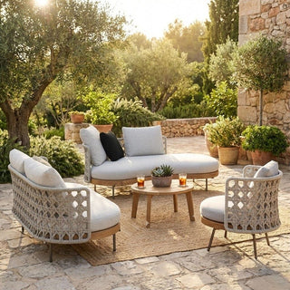 Outdoor patio set with cushions in a garden setting